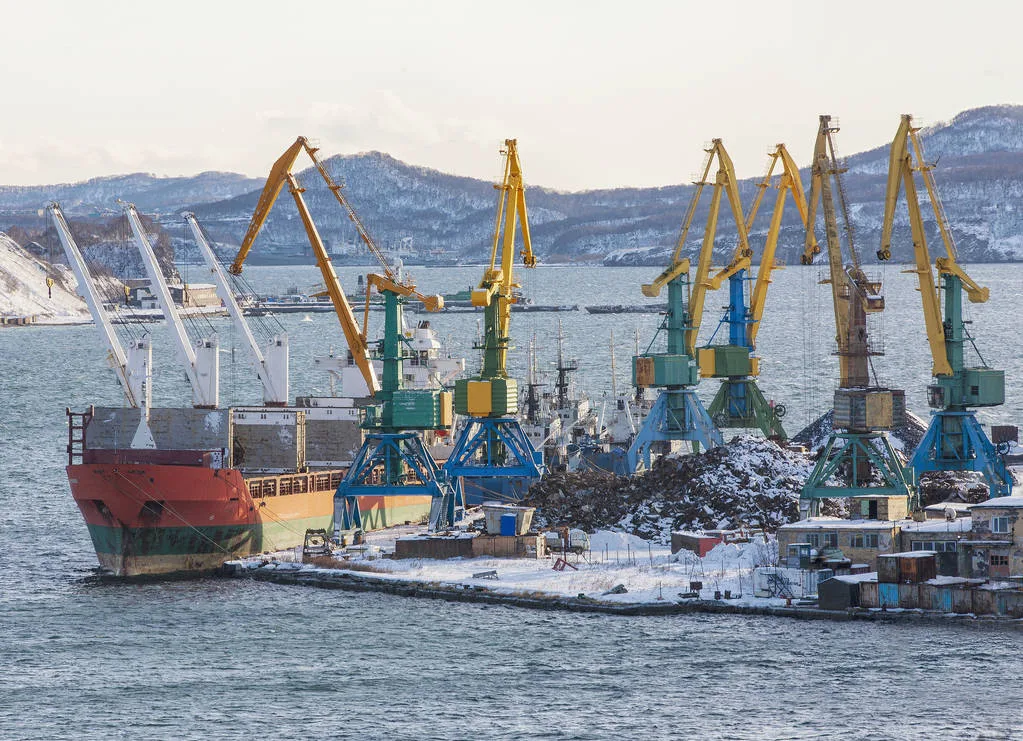 winter seaport with ships and cranes